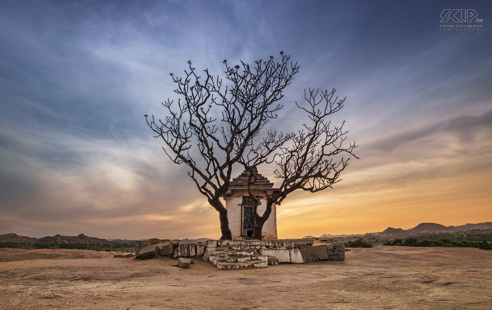 Hampi - Hemakuda hill - Hanuman shrine The small Hanuman shrine at the Hemakuta hill in Hampi at sunset. Hampi was one of the richest and largest cities in the world from the 13th to 17th century. It is still a magical place with beautiful landscapes rocks, boulders and palm trees and impressive ruins of temples, palaces and shrines. Stefan Cruysberghs
